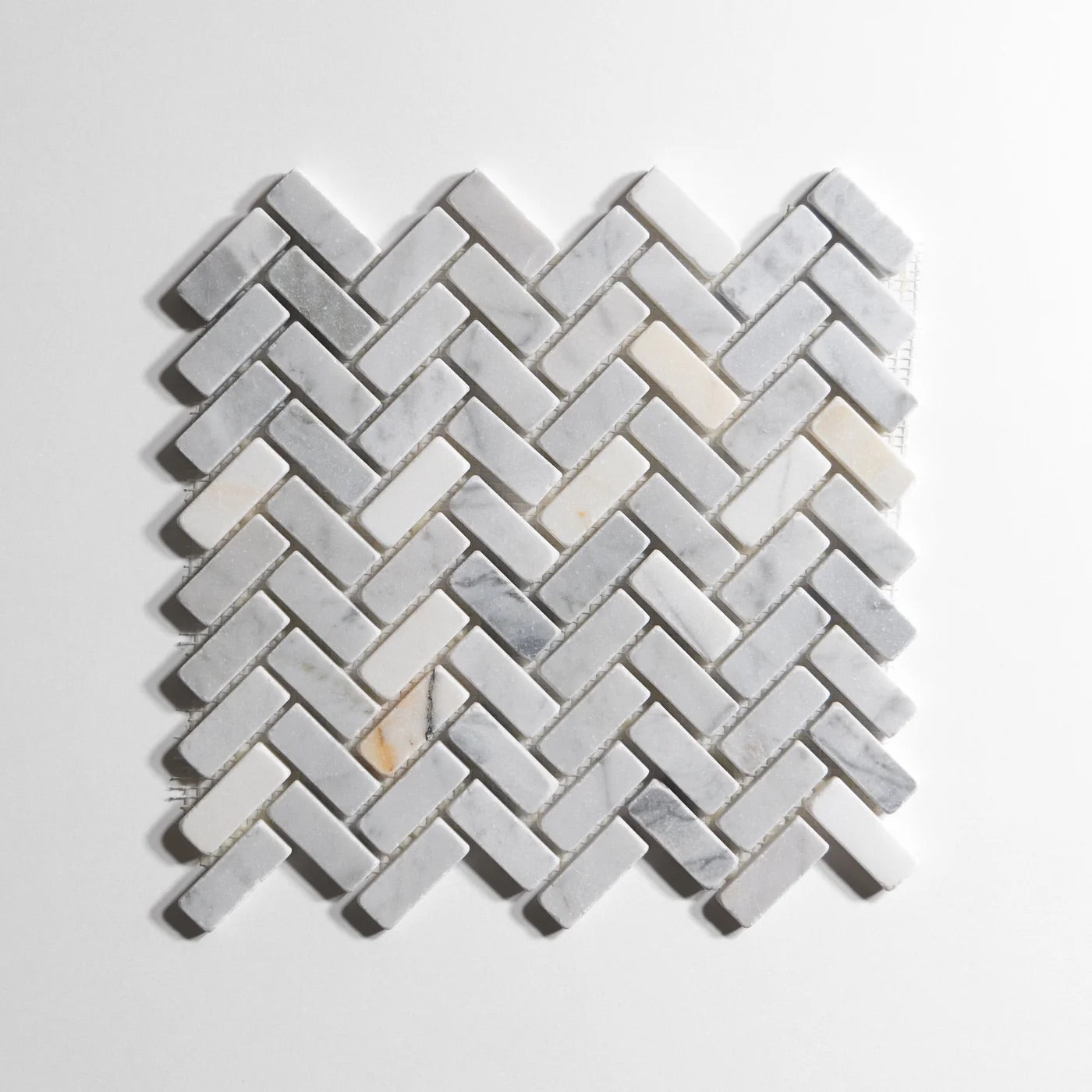 bianco_jolie_antique_herringbone_1_X_2_12X13SHEET_Honed