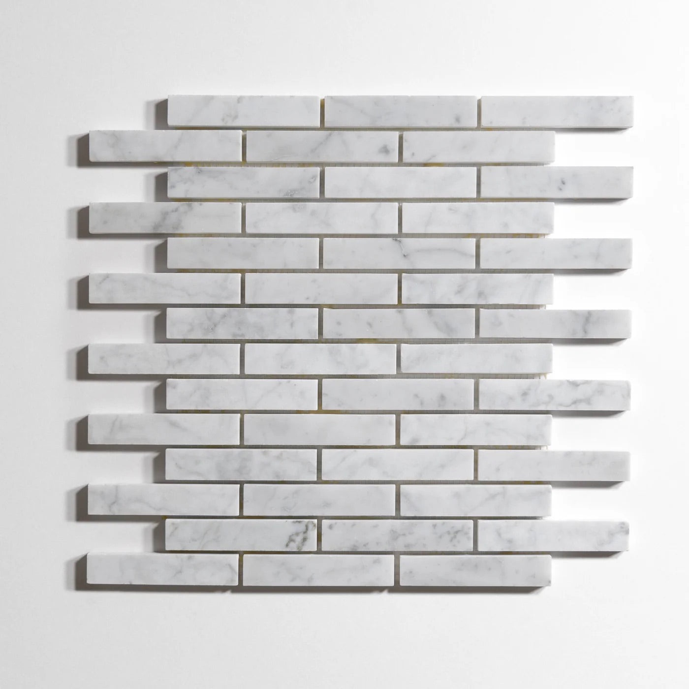 bianco_jolie_vena_mini_brick_1_X_4_12X12SHEET_Honed